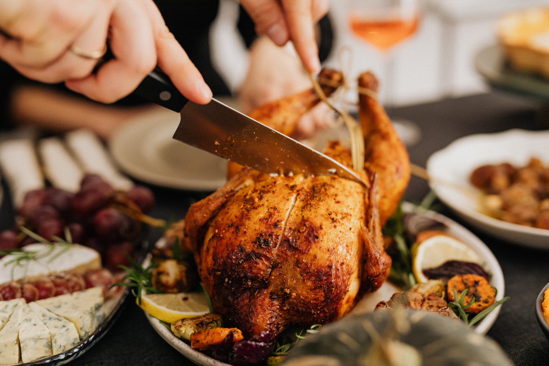 cutting roasted chicken in close up