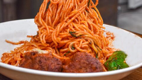 spaghetti with meatballs on ceramic plate