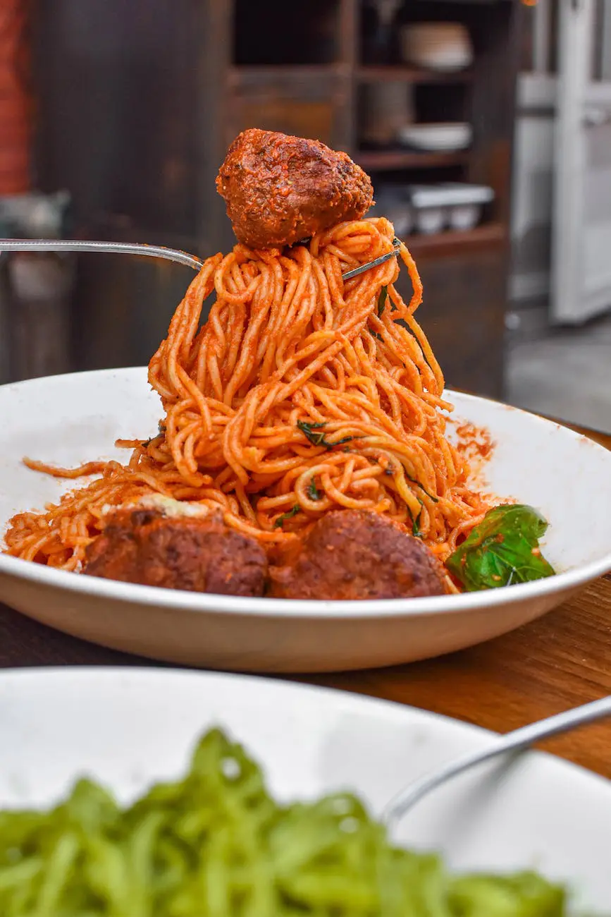 spaghetti with meatballs on ceramic plate
