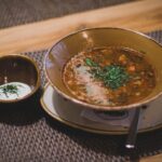 brown ceramic bowl with brown soup