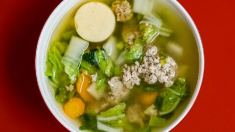 stew with meat and vegetables placed in white ceramic bowl