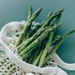 a fresh asparagus on a mesh bag