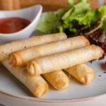 spring rolls on white ceramic plate