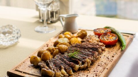 rib eye steak on a wooden board